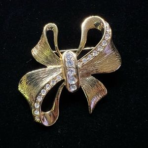 Vintage Lady Remington Rhinestone Gold Tone Bow Brooch Rhinestone Studded Signed